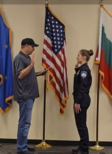 Brianna Miller is shown as she is sworn in at the New Lexington Police Department.