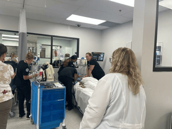 Nursing students in learning lab.